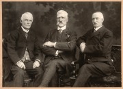 H.C.A. HARRISON: Original mounted photograph (22.5 x 30cm overall) by Talma & Co. Melbourne, showing Harrison seated at left beside what are thought to be T.S. Marshall (VFA Secretary, middle) and E.L. Wilson (VFL Secretary, at right); believed to have be