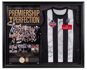 COLLINGWOOD - PREMIERSHIP PERFECTION: Limited-edition framed display featuring a fully signed guernsey signed by all the players, a replica premiership medal, and a replica Norm Smith medal; marked 'Limited Edition Sample 125', 86 x 107cm overall.