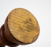 A replica Ashes urn in timber, on matching timber plinth, engraved at base "Made By Alan Kelly Mornington Vic(toria)", with details of the triumphant 1989 Australian team affixed to the base; height 26cm. - 2