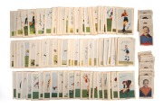 KORNIES CIGARETTE CARDS: Group comprising 1948 "Victorian Footballers" part-set [15/64], 1949 "Victorian Footballers" part-set [8/108], 1951 "Footballers In Action" complete set [64], 1952 "Footballers In Action" complete set [64], and 1953 "Footballers I