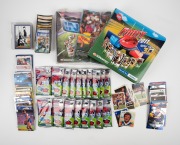 TRADING CARDS: An accumulation of trading cards, mostly Select/Herald Sun/Cazaly Classics and featuring Western Bulldogs players, including many 2011 Herald Sun cards in matching album, 2012 Herald Sun full base set (all still in sealed packs) with matchi