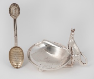 49 · An antique silver plated condiment dish adorned with a kangaroo and cricket bat with cricket ball feet; together with a sterling silver teaspoon with kangaroo top "AUSTRALIA VS. ENGLAND" emblazoned with the 1926 Test team names, 7cm and 10cm high. (2 items)