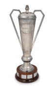SWANS BEST & FAIREST TROPHY: Original silver-plated trophy mounted on a timber plinth, inscribed "Swann Insurance Perpetual Trophy for Best & Fairest Player - South Melbourne Football Club", the plinth with plaques engraved Norm Goss 1974, Peter Bedford 1