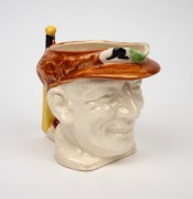 1936 Don Bradman toby jug manufactured by Marutomo Ware, with cap in brown, height 15cm.