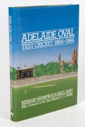 DON BRADMAN: "Adelaide Oval Test Cricket 1884 - 1984" by Whimpress and Hart [Adelaide : Wakefield Press, 1984 1st ed.], 262pp, hard cover with dust jacket, signed in pen to the title page by Don Bradman. - 2