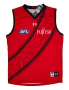 ESSENDON FOOTBALL CLUB jersey, size large, signed by members of the 2024 team, including Kyle Langford, Nick Bryan, Dyson Heppell, Jordan Ridley, Nick Cox, Dylan Shield and Nick Hind.