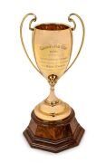 THE 1948 CAULFIELD CUP engraved "CAULFIELD CUP 1948 - WON BY - MESSRS A.W. STEELE & M. RESS & EXORS. ESTATE OF LATE H. HILLS - ch h RED FURY - Trainer J. FLANNERY - Rider W. Briscoe", the magnificent solid 9ct gold twin-handled cup of 654gms; raised on tu