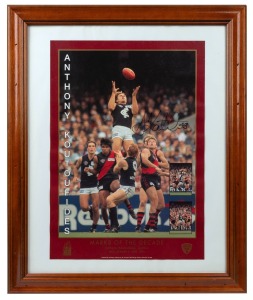 ANTHONY KOUTOUFIDES: AFL-licenced "Marks Of The Decade - MCG, Round 2, April 1996" signed display, limited edition 52/500 with CoA, framed and glazed, 58 x 47cm overall, together with Brad Ottens signed and framed display, 40 x 32cm overall. (2 items)