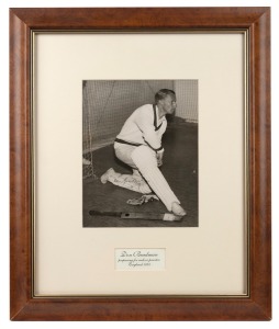 Don Bradman original signature on reproduction photograph captioned "Don Bradman preparing for indoor practice, England 1934", framed and glazed, 48 x 40cm overall, together with original signed photograph of Dennis Lillee with CoA, framed and glazed, 31 x 26cm overall. (2 items)