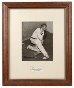 Don Bradman original signature on reproduction photograph captioned "Don Bradman preparing for indoor practice, England 1934", framed and glazed, 48 x 40cm overall, together with original signed photograph of Dennis Lillee with CoA, framed and glazed, 31 