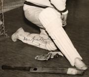 Don Bradman original signature on reproduction photograph captioned "Don Bradman preparing for indoor practice, England 1934", framed and glazed, 48 x 40cm overall, together with original signed photograph of Dennis Lillee with CoA, framed and glazed, 31 - 2