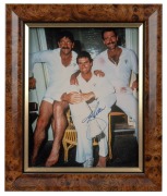 Don Bradman original signature on reproduction photograph captioned "Don Bradman preparing for indoor practice, England 1934", framed and glazed, 48 x 40cm overall, together with original signed photograph of Dennis Lillee with CoA, framed and glazed, 31 - 3
