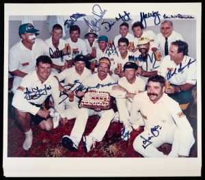 173 · THE DAY ALLAN BORDER SCORED HIS 10,223rd RUN: Photograph depicting the Australian team around Allan Border holding a congratulatory cake from XXXX that reads "Congratulations Allan Border From XXXX And All Cricket Lovers", signed by most of those present including Border, Steve and Mark Waugh, Mark Taylor, Shane Warne, Damien Martyn, David Boon, and Bob Simpson. (10 examples, each 25.5 x 31 overall, all with the same signatories)