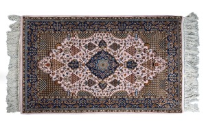A fine quality Persian hand-knotted silk rug on pink ground 175 x 93cm including tassels.