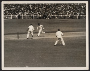 THE BODYLINE SERIES - THE MELBOURNE TEST MATCH - AUSTRALIA'S ONLY WIN Six original "Herald Feature Service" press photographs, all 20 x 25cm format, and each image with copyright stamps and printed explanatory slip affixed verso. Annotations include "O'Brien run out for 10...", "Ames goes cheaply...", "Voce caught in the slips by McCabe...", "Excited crowd Chairs Woodfull after Australia's Test Win." (6 items).