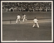 THE BODYLINE SERIES - THE MELBOURNE TEST MATCH - AUSTRALIA'S ONLY WIN Six original "Herald Feature Service" press photographs, all 20 x 25cm format, and each image with copyright stamps and printed explanatory slip affixed verso. Annotations include "O'B