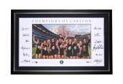 "CHAMPIONS OF CARLTON" 2014 print by Dave Thomas, with twelve original signatures including those of John Nicholls, Stephen Kernahan, Bruce Doull, Alex Jesaulenko, and Greg Williams; limited edition #19/150, CoA present, window mounted, framed and glazed,