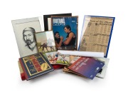 Remainder lot mostly comprising VFL/AFL-related items, including two 2010s WEG posters, six framed images/photographs, a scrapbook containing many newspaper clippings documenting 1960s-70s VFL happenings, three books, and other ephemera. (qty.)
