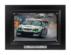 CRAIG LOWNDES - 2001: Ten identical framed and glazed signed photographs of Lowndes in his Gibson Motorsport AU XR8 Falcon, limited edition 71-80/100, each 33 x 43cm overall. (10 items)