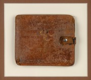 Ron Clarke's personal Melbourne 1956 XVIth Olympiad leather wallet, framed and glazed, 59.6 x 36.5cm overall, with signed September 2000 letter from Clarke regarding the wallet also featured. - 2