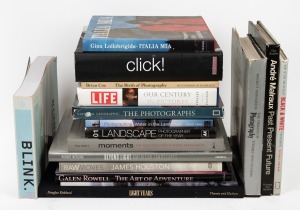 PHOTOGRAPHY: A shelf of books including "The Origins of Photography" by Gernsheim, "Andre Malraux" by Suares, "Click!" "Raw Moves" by Houston, "Beyond Light - American Landscapes" by Werling, "The Art of Adventure" by Rowell, "Light Years" by Kirkland, 'I