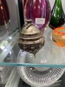 A sterling silver shell shaped dish, a Continental silver spoon, a Continental silver lidded box with rose decoration, a silver plated torah pointer (yad), a silver plated filigree spice box and a green Murano glass dish with silver mount, 19th and 20th c - 2