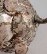 An antique English sterling silver cream jug with floral repousse decoration; together with a sterling silver apostle spoon (unknown age), (2 items), ​​​​​​​the jug 11.5cm high, 174 grams total. - 2