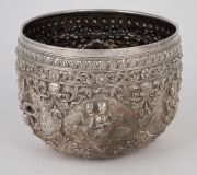 An antique Burmese silver bowl with repousse vignettes and floral decoration, 19th/20th century, 11cm high, 15cm wide, 442 grams. - 2