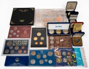 VARIOUS COUNTRIES: Diverse accumulation of coins and coin sets from such countries as Canada, East Caribbean States, UAE, and South Africa; noted 1982 Macau 100 patacas (sterling silver) and 1993 Marshall Islands $50 silver Elvis Presley commemorative. (q