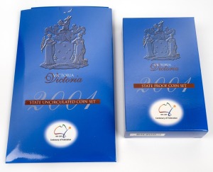 CENTENARY OF FEDERATION - VICTORIA: Three-coin proof set in presentation case with box and CoA, together with matching three-coin uncirculated coin set in sleeve packaging. (2 items)