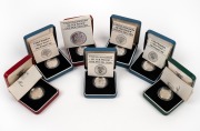 GREAT BRITAIN: SILVER PROOFS - ONE POUND: Group comprising years 1983 (2), 1983 (piedfort). 1984, 1985, 1986, and 1987; all in presentation cases with CoA. (7 items)