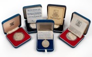 GREAT BRITAIN: SILVER PROOFS: Group comprising 1977 Queen's Silver Jubilee Crown (2), 1981 Royal Marriage, 1982 Falkland Islands Liberation Crown, together with 1977 Elizabeth R Silver Pendant; all in presentation cases. (5 items)