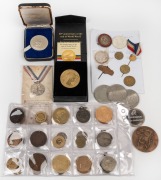 A small range of Australian and foreign medallions, tokens, and souvenirs; noted a Mexican gold half escudo on a pin. (45 items)