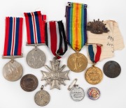 A small group including a 1914-19 Victory Medal (to an Engineer R.N.R.), two 1939-45 Service medals (one named), various royal event medallions, etc. (Total: 11 items).