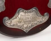 SWANS BEST & FAIREST AWARD: Original ornate wooden shield with metal plaque and annual additions, inscribed "South Melbourne Football Club - Perpetual Trophy - Best And Fairest Award - Donated By Yellow Cabs Of Australia", engraved Russell Cook 1972, Pete - 5