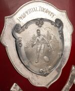 SWANS BEST & FAIREST AWARD: Original ornate wooden shield with metal plaque and annual additions, inscribed "South Melbourne Football Club - Perpetual Trophy - Best And Fairest Award - Donated By Yellow Cabs Of Australia", engraved Russell Cook 1972, Pete - 8