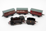 HORNBY (O Gauge) tinplate clockwork locomotive, tender and three carriages.