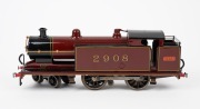 L.M.S. (O Gauge) vintage tinplate electric locomotive in burgundy and black livery with oval "LMC" badge (Leeds Model Company of England).