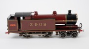 L.M.S. (O Gauge) vintage tinplate electric locomotive in burgundy and black livery with oval "LMC" badge (Leeds Model Company of England). - 2