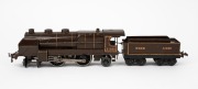 HORNBY (O Gauge) tinplate electric locomotive and tender in brown livery.