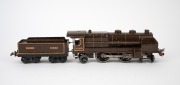 HORNBY (O Gauge) tinplate electric locomotive and tender in brown livery. - 2
