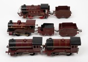 HORNBY (O Gauge) group of four tinplate clockwork locomotives and three tenders, all in burgundy livery.