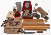 Assorted group of vintage advertising wares, attractive bakelite jar, rulers, milkshake container, shoe last, pepper grinder, oil lamp, picture frame, paper spike, vintage badge, Teledex, scissors etc., (qty).