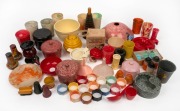 A collection of assorted coloured and mottled bakelite household objects including napkin rings, jars, ashtrays, beakers etc., including some rarities, (qty).