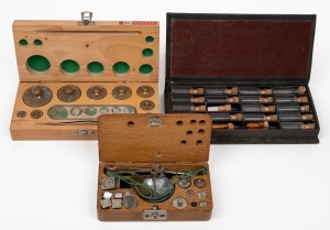 Boxed apothecary weights, scales and glass vials, early to mid 20th century, (3 items), the largest 17cm wide.