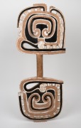 A tribal shield, carved wood with remains of piped clay and ochre finish, Sepik River, Papua New Guinea origin, 20th century, ​​​​​​​74cm high. - 2