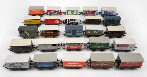 A group of 25 goods wagons (O gauge), home-made with tinplate advertising on Hornby rolling stock.