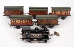 Tinplate L.M.S. clockwork locomotive with five assorted carriages, (6 items).