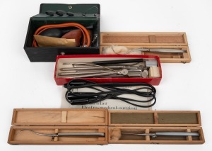 Group of medical instruments including "WYETH" steel syringe pump, three surgical probes in matching timber cases, and several others. (qty.)