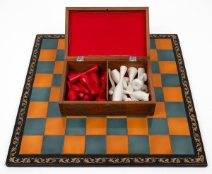 CHESS SET with green and gold tile top board mounted in embossed leather with turned and carved timber pieces with red and white painted finish, late 20th century, the board 45 x 45cm overall.